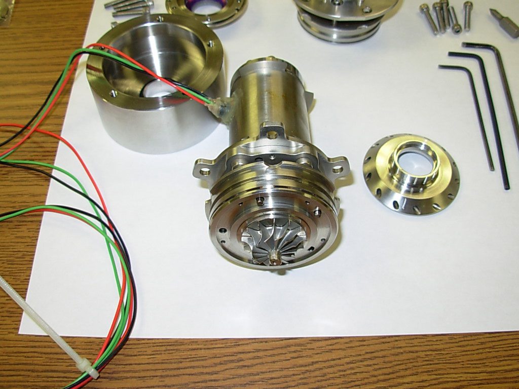 A close up of the motor and parts on a table